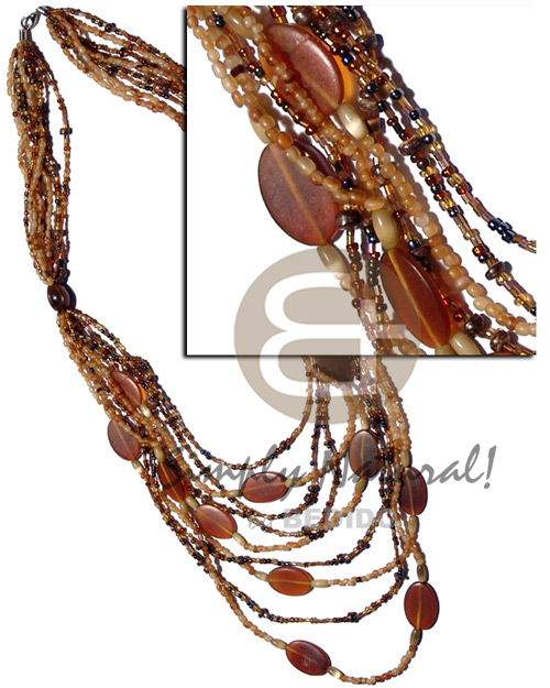 9 graduated layers of cut beads and amber carabao horn beads  matching amber horn flat oval accent / 34 in. - Graduated Necklace