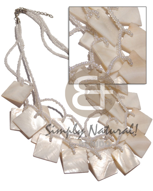 3 graduated rows of pearl white glass beads ( 17"/17.5"/18" )  dangling and looped 25pcs. of 25mm square nat. white kabibe shells / - Graduated Necklace