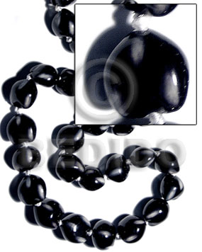 16 pcs. of kukui nuts in high polished paint gloss color in black/white combination / cats eye - Kukui Lumbang Nuts Beads