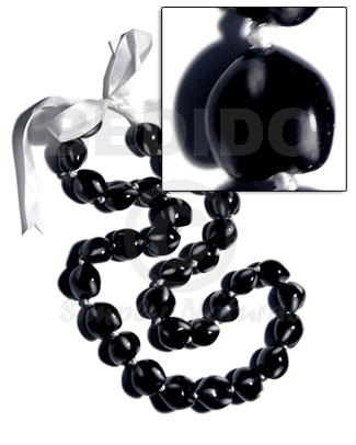 32 pcs. of kukui nuts in high polished paint gloss color in black/white combination in matching adjustable ribbon /lei/ 36in - Leis
