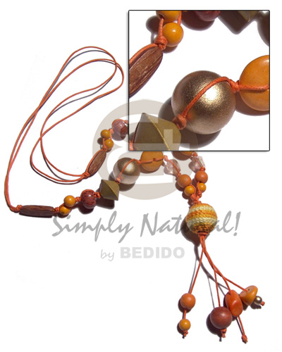 2 layers tassled wax cord  asstd. wood beads combination in orange tones and 20mm gold and wrapped round 20mm wood bead / 28in plus 3in tassles - Tassled Necklace