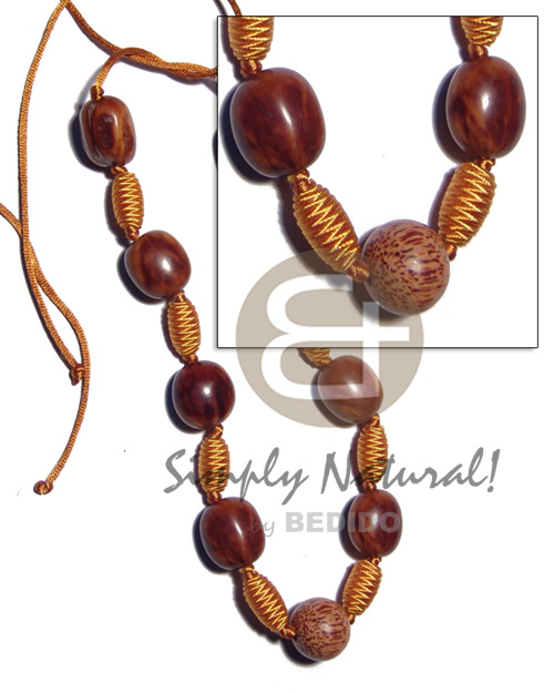 capsule wrapped wood beads  rubber seed, palmwood combination in golden satin cord / 36in adjustable - Wood Necklace