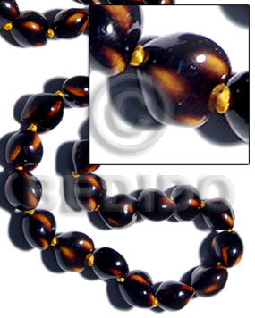 16 pcs. of kukui nuts in high polished paint gloss dark brown/yellow combination  / cats eye - Kukui Lumbang Nuts Beads