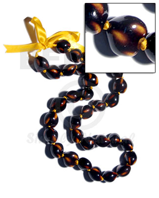 32 pcs. of kukui nuts in high polished paint gloss dark brown/yellow combination  in matching ribbon /lei / 36in - Leis