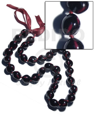 32 pcs. of kukui nuts in high polished paint gloss marbleized black/fuschia pink combination  in matching ribbon /lei / 36in - Leis